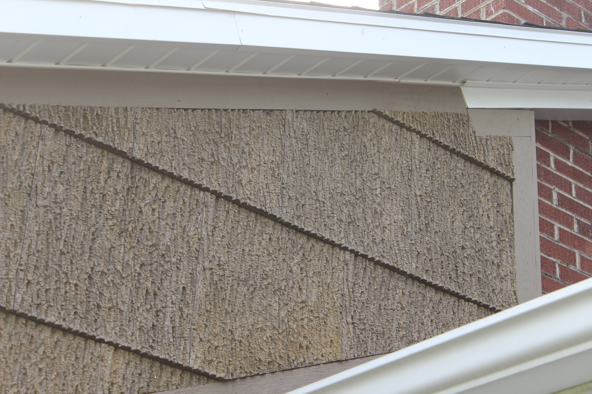 How Does SmartBark Old Style Poplar Gray Look with Brick? See for Yourself